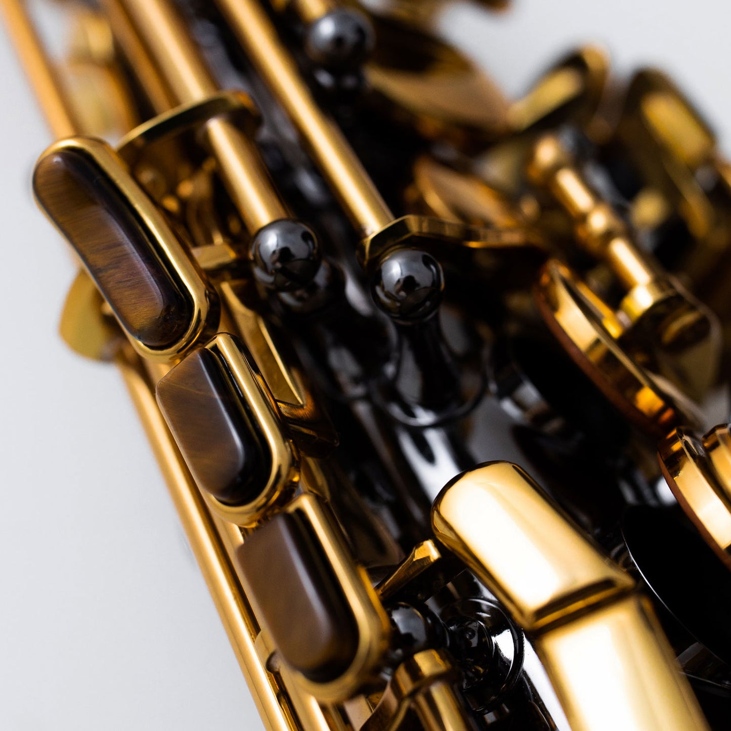 Detail of Cannonball A5-BL alto saxophone rods, posts and gold lacquer keys